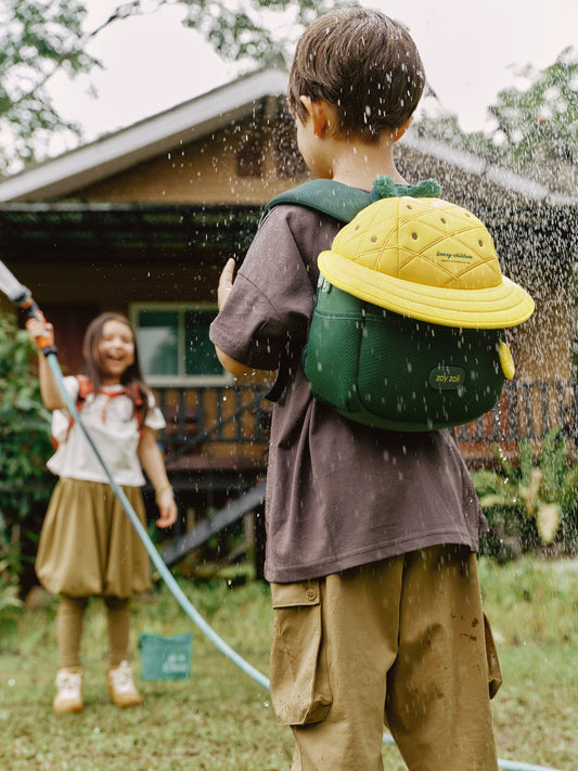 Mochila infantil con diseño de piña amarilla y verde