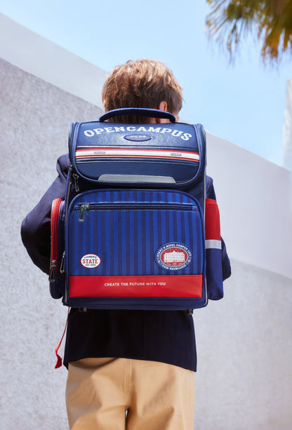 Zoy Zoii mochila escolar infantil azul y roja con diseño clásico, compartimentos amplios y tirantes acolchados para mayor comodidad, ideal para niños en primaria