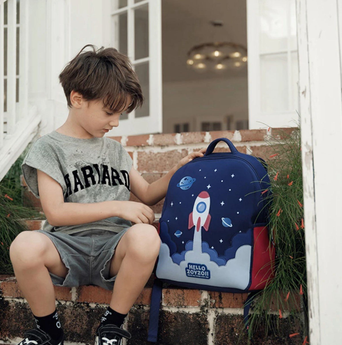 Mochila escolar para niños con diseño de planeta y estrellas