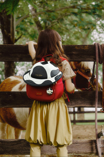 Mochila Zoy Zoii roja con diseño de manchas en blanco y negro
