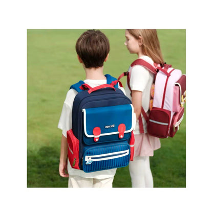 Zoy Zoii mochila escolar azul con detalles rojos, diseño clásico con bolsillos frontales, cremallera resistente y correas acolchadas, ideal para niños en la escuela primaria