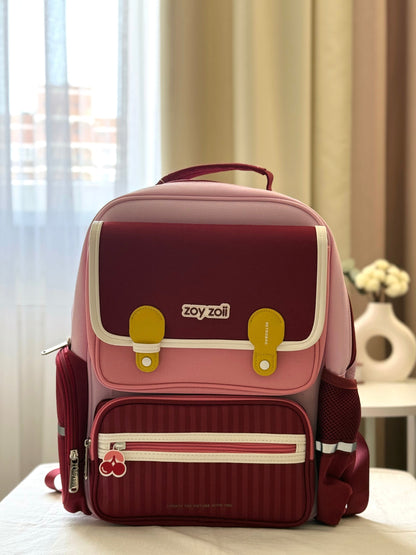 Mochila escolar Zoy Zoii para niñas en color rojo y rosa con tirantes acolchados, bolsillo frontal con cremallera y diseño práctico para uso diario